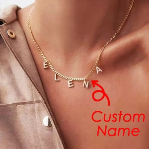 Close-up of a personalized stainless steel necklace with ELENA zircon letters on a model