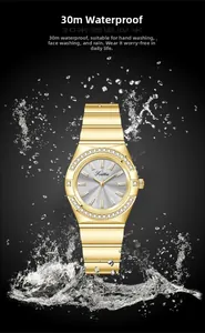 Detailed view of women's gold watch with rhinestone bezel showing 30m water resistance