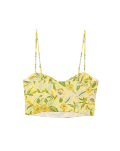 Close-up of yellow floral print camisole featuring spaghetti straps and linen texture