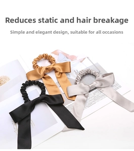 Three premium silk bow scrunchies in gold, silver, and black on a magazine backdrop