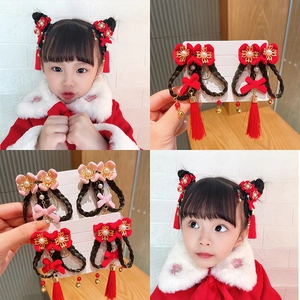Detailed views of traditional Chinese hair clips with mink fur tassels and braided hair