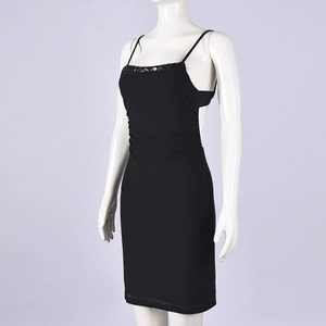 Detailed close-up of a slim fit black sequin dress with backless mesh and sequin trims