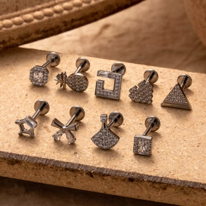 G23 titanium labret studs set with cubic zirconia in assorted geometric shapes
