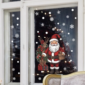Detail of Christmas window stickers featuring Santa Claus and reindeer on glass pane