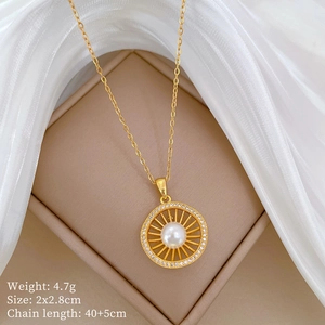 Detail of gold hollow nest necklace with pearl, pavé crystals and size parameters