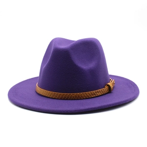 Detail of dark purple wool fedora with a brown snakeskin texture belt and metal buckle