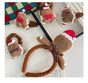 Detail of plush gingerbread man Christmas hair accessories set with headband and clips