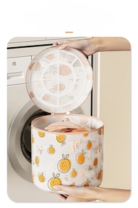 Close-up of a cylindrical mesh laundry bag with orange print for delicate washing