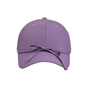 Detail view of purple quick-dry baseball cap featuring a decorative bow and breathable side vents