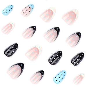 Almond shaped press-on nails with French tip patterns and classic polka dot designs