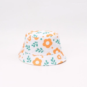 Detail showing the vibrant orange flower prints on soft white cotton children's bucket hat