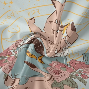 Detailed close-up of tarot tapestry showing zodiac symbols and mystical moon patterns