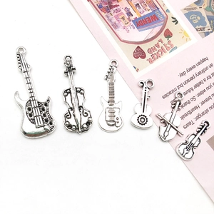 Set of 6 vintage silver musical instrument charms including violin and guitars
