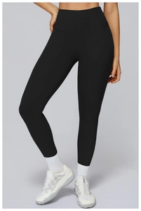 Detail of high waisted black yoga leggings with seamless design and compression fit