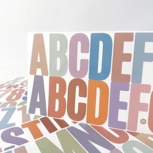Macro shot of 2.5-inch Morandi colored alphabet stickers for classroom decoration