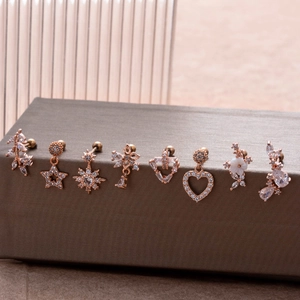 Rose gold stainless steel stud earrings set featuring heart, star, and flower designs