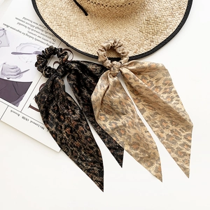 Set of two leopard print scrunchies with long streamers in dark and light brown tones