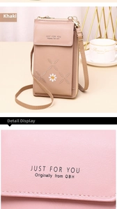 Close-up detail showing the textured leather and floral embroidery of the phone bag
