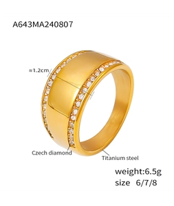 Macro shot of 18k gold plated titanium steel wide band ring with Czech diamond borders