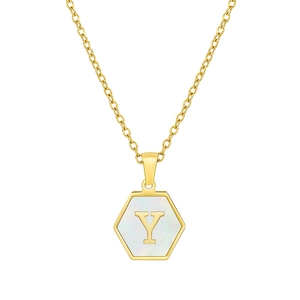 Detail showing gold hexagon pendant with white shell inlay and letter Y engraving
