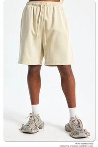 Detailed shot of light beige cotton drawstring waistband with retro knit texture