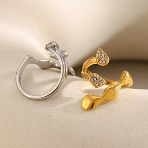 Macro detail of abstract 18K gold and silver plated open rings with zircon inlay