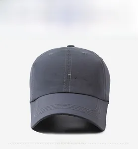Detail of grey baseball cap showing 3D metallic Consistance font and breathable vents