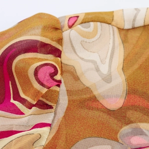 Detailed view of paisley chiffon blouse shoulder stitching with abstract ripple print