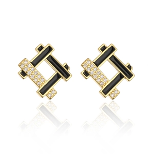 Detail of 18K gold plated geometric stud earrings with black inlay and zircons