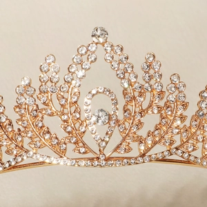 Detailed macro view of the gold leaf crown featuring teardrop crystals and intricate metalwork
