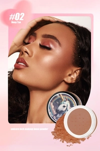 Detailed macro view of #02 Deep Tan unicorn loose powder with fine matte texture