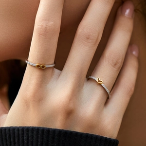 Elegant s925 silver rings with gold heart and infinity symbols, paved with sparkling zircons