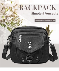 Détail du sac bandoulière noir avec texture cuir grainé et rivets métalliques argentés
