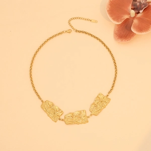 Detailed view of gold irregular square metal pendants with unique wrinkled texture