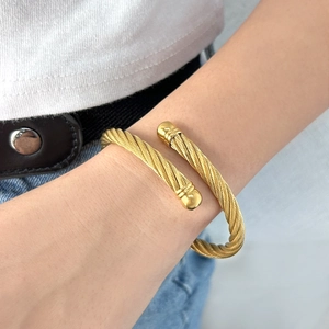 Hip hop style gold stainless steel cable twist cuff bracelet with smooth ball ends