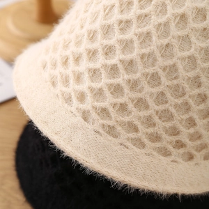 Handmade crochet faux mink fur bucket hat with hollow knit design in beige and black