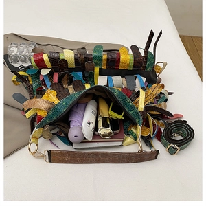 Macro top view of large capacity crossbody bag interior showing organized daily essentials