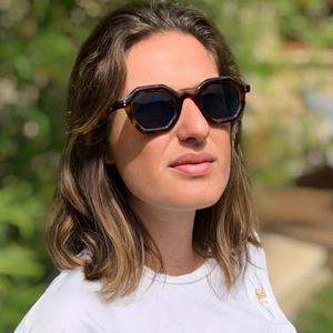 Outdoor portrait of tortoiseshell geometric sunglasses with brown UV lenses