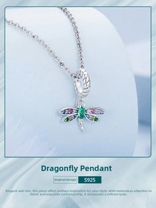 Macro shot of S925 sterling silver dragonfly pendant with colorful zircon stones