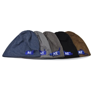Detailed view of knitted beanies in five colors with AE labels and adjustable drawstrings