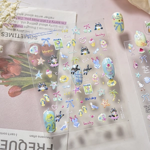 Detail view of 3D embossed summer cat nail stickers with glitter seashells and ice cream