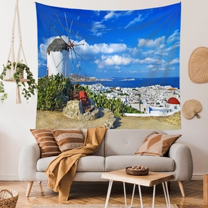 Detail of Mykonos tapestry showing white windmills and blue sea in a modern living room