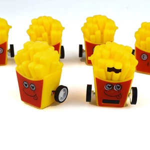 Close-up of cute cartoon french fries pull-back toy cars with funny facial expressions