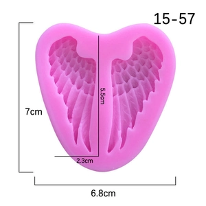 Pink heart-shaped silicone mold with angel wings design for baking and DIY soaps