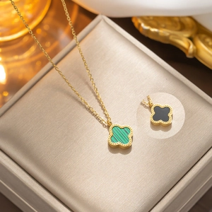 Golden clover pendant necklace with green malachite and black shell variant options