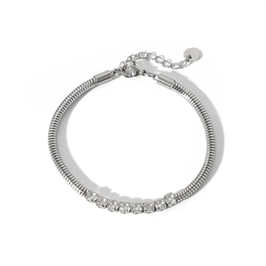 Macro detail of silver snake chain bracelet with sparkling round cubic zirconia stones