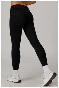 Detail of high waist yoga pants showing ruched waistband and lifting effect on back side