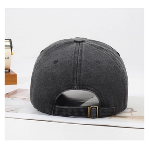 Detail of adjustable metal buckle on dark grey washed cotton baseball cap with denim texture