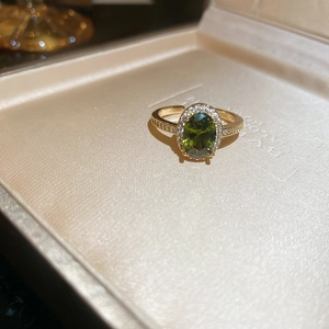 Close-up of 18k gold plated tiger eye ring with halo zircon setting and adjustable band
