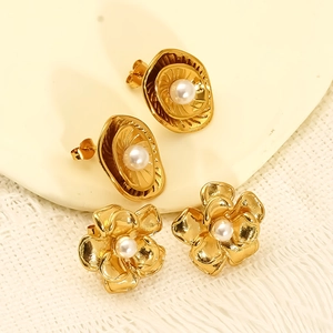 Elegant gold-tone flower and circular earrings with white pearls and vintage metal finish